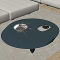 Modern Gray Round Coffee Table With Dried Branches And Tray On Carpet