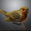 Vibrant Bird Sculpture With Orange Chest Yellow Head Wings On Reflective Grey Surface