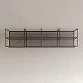 Black Metal Mesh Wall Hanging Decorative Shelf With Multiple Compartments On Light Colored Wall