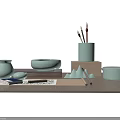 Light Green Ceramic Desk Items With Brushes Notebook And Mountain Decor On Wooden Table
