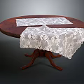 Elegant Round Wooden Dining Table With White Lace Tablecloths And Carved Pedestal Base