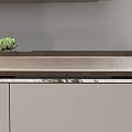 Modern Gray TV Stand With Silver Grille Panel And Small Green Succulent Plant