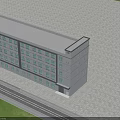 Multi Storey Industrial Factory Building Featuring Large Windows Gray Exterior Blue Sky Green Grass Background