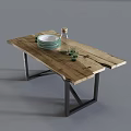 Rustic Wooden Dining Table with Metal Legs Featuring White Plates Green Glasses and Glass Bottle