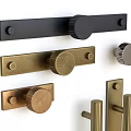 Various Styles of Brass Black and Silver Metal Door Handles on White Background