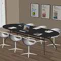Modern Meeting Space With Black Oval Table White Chairs Laptop And Wall Posters