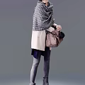 Stylish Woman Wearing Beige Coat Plaid Scarf Holding Patterned Handbag And Fitted Pants