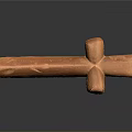 Orange Cross Shaped Sculpture Carving With Textured Surface And Black Background