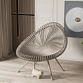 Modern Light Color Rattan Leisure Chair With Decorative Painting Ceramic Figurine And Green Plant