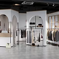 Modern Clothing Store Interior With Arched Doorways Clothing Racks And Mirrors
