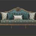 Classic Turquoise Sofa With Ornate Golden Carvings And Patterned Fabric Pillows
