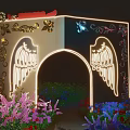 Ornate Decorative Archway With Illuminated Wings Golden Patterns And Surrounding Purple Blue Red Flowers