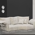 Contemporary Living Room With Beige Fabric Irregular Shaped Sofa And Wall Lighting