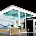 Modern Exhibition Booth Design With Glass Facade Reception Counter And Green Plants