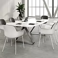 Modern Conference Room Interior With Round Table White Gray Chairs Laptop And Green Plant