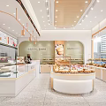 Dessert Shop Interior Design With Glass Display Cases Fresh Pastries And Round Counter