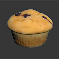 Golden Blueberry Muffin With Purple Spots And Soft Texture On Dark Surface