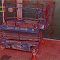 Blue Genie GS-3246 Scissor Lift Industrial Equipment on Red Ground with Orange Traffic Cones