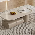 Modern Beige Coffee Table With Sleek Surface Bowl of Fruits Cup and Oval Top on Rug