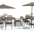 Outdoor Rattan Table And Chair Set With Umbrella And Decorative Flowers