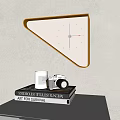 Triangular Wall Clock with Orange Frame and White Dial Above Books Camera and Candle 3d model