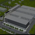 Modern Industrial Factory Complex With Multiple Buildings Flat Roofs And Surrounding Trees