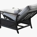Comfortable White Cushioned Lounge Chair With Black Wicker Frame And Ottoman