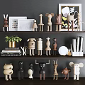 Wooden Animal Shaped Dolls on Shelf Display with Books Plants and Framed Art