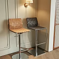 Brown and black bar stools with woven seat backrest and metal legs in modern corner