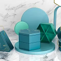 Decorative Ornament Set with Teal Green Geometric Shapes and Gold Accents on Marble
