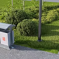 Lush Green Plants And Lawn With Trash Bin And Lamp Post In Park Landscaping