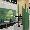 Vibrant Green And Yellow Dessert Shop Interior With Glass Display Cases And Pastry Posters