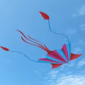 Colorful Pink And Blue Kite With Red Tails On Light Blue Background