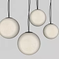 Four White Spherical Pendant Lights with Black Wires Against Grey Wall Modern Design