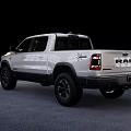 White Ram 1500 Crew Cab Pickup With Off Road Tires And Black Wheels