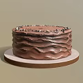 Delicious Chocolate Cake With Ruffled Frosting Topped With Chocolate Sprinkles On Round Plate