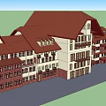 Multi Story Building Exterior With Red Roof White And Brown Walls And Windows