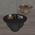 Modern Round Top Coffee Table With Black And Beige Spherical Base And Decorative Items 3d model