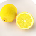 Fresh Bright Yellow Lemons Whole And Cut On White Plate Healthy Fruit