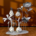 Colorful Floral Display With Orange White Pink Flowers In Spherical Vases On White Pebble Base