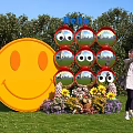 Giant Yellow Smiley Face Photo Spot With Mirror Wall Hello Sign And Flower Arrangement