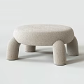 Beige Upholstered Stool With Curved Seat Design And Unique Wooden Leg Structure