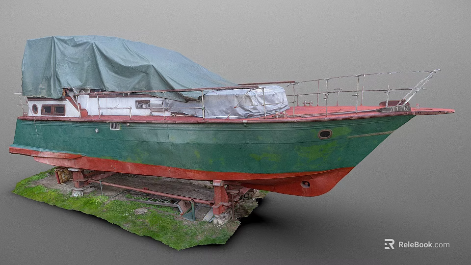 Green and Red Hull Yacht Covered with Tarpaulin on Stands in Grass Area 3d model 
