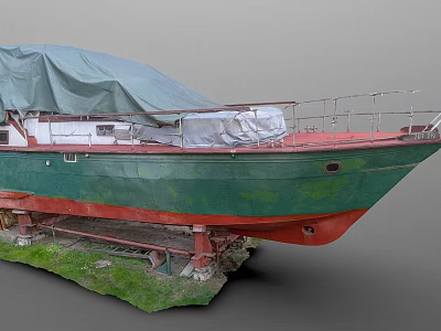 Green and Red Hull Yacht Covered with Tarpaulin on Stands in Grass Area 3d model