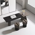 Modern Black Desk With Laptop White Vase Dried Grass And Round Stools In Bright Room
