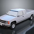 Silver Extended Cab Pickup Truck With Shiny Surface On Black Background