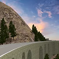 Stone Arch Bridge Road With Ambulance Truck And Green Trees On Mountain Scenic Sunset