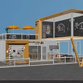 Yellow Container Building Café Restaurant With Large Windows Outdoor Seating And Umbrellas