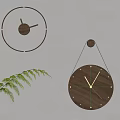 Minimalist Wooden Wall Clocks with Natural Design Hanging on Light Gray Wall and Green Leaf