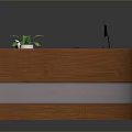 Curved Wooden Office Desk With Computer Monitor Keyboard Telephone And Potted Plant